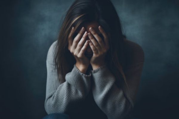 206903481-vulnerable-woman-at-home-experiencing-depression-and-burnout-conveying-emotional-struggle-and