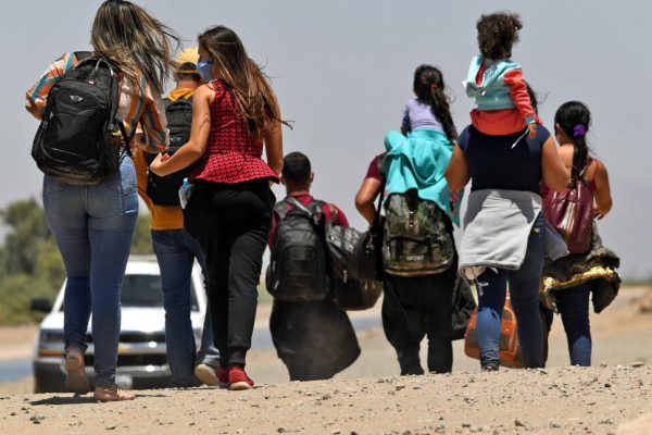 SAN LUIS, AZ - MAY 21: Migrants attempting to cross in to the U.S. from Mexico are detained by U.S. Customs and Border Protection at the border May 21, 2021 in San Luis, Arizona. (Photo by Nick Ut/Getty Images)